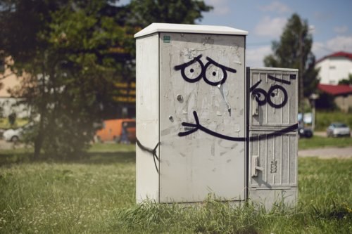 painted power boxes hugging